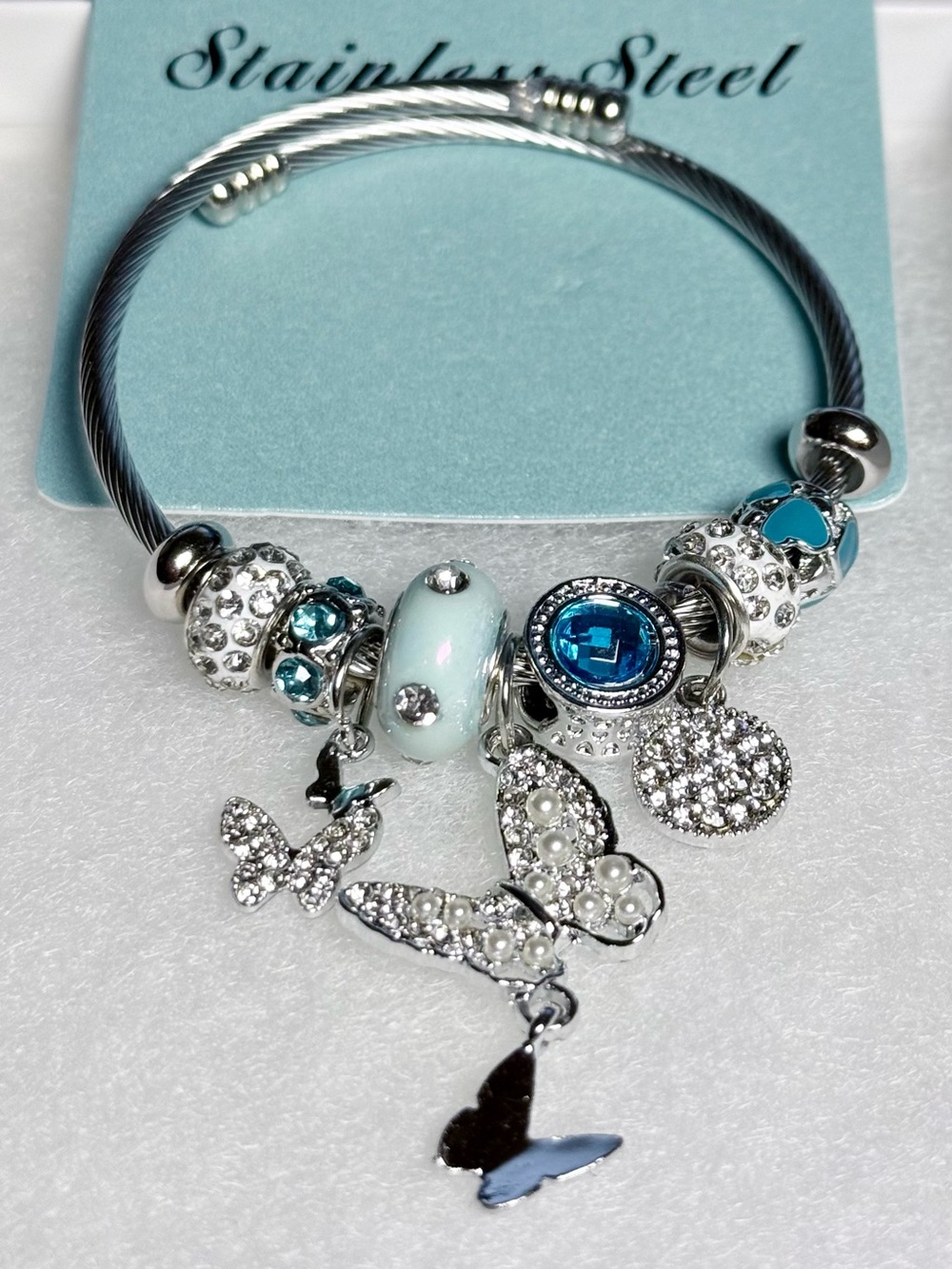 Stainless Steel Silver Charm Bracelet with Blue and White Accents